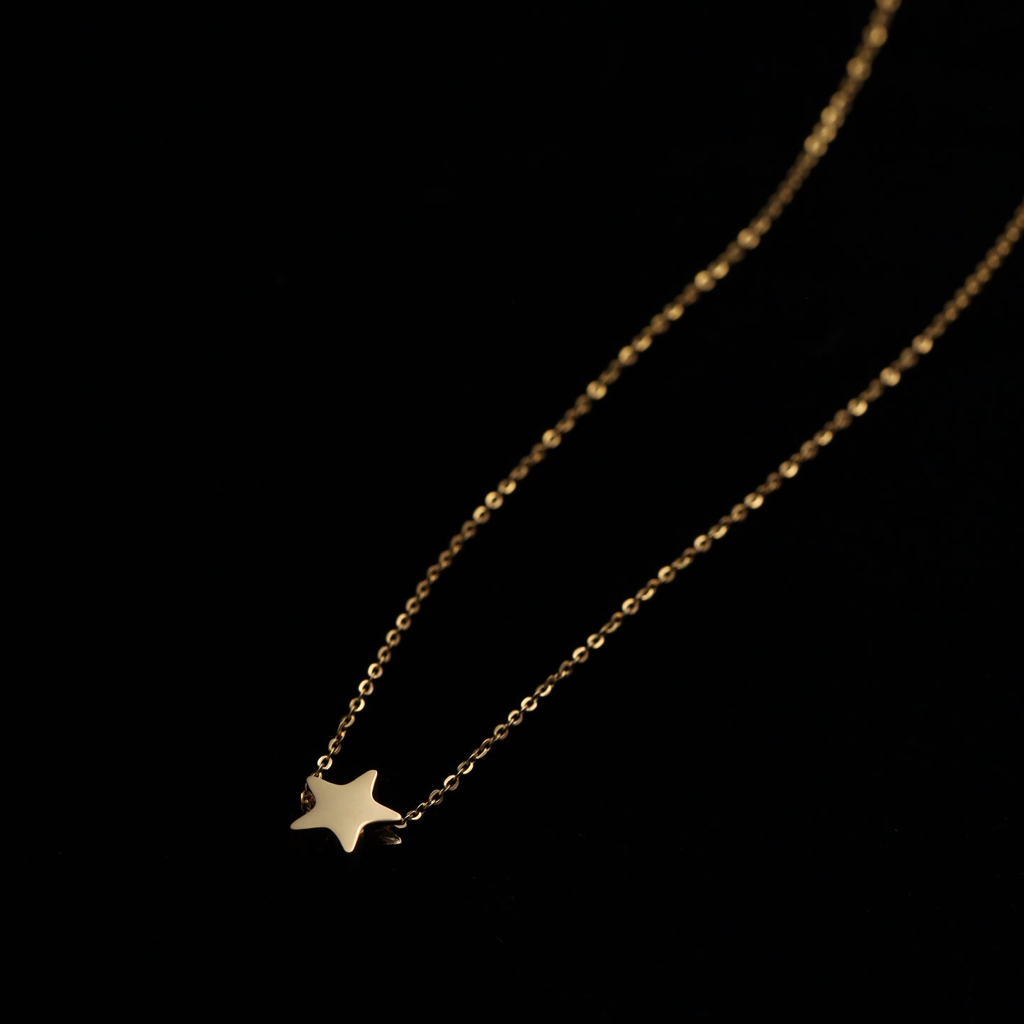 Dainty stainless steel star necklace, perfect for layering with other celestial pieces.