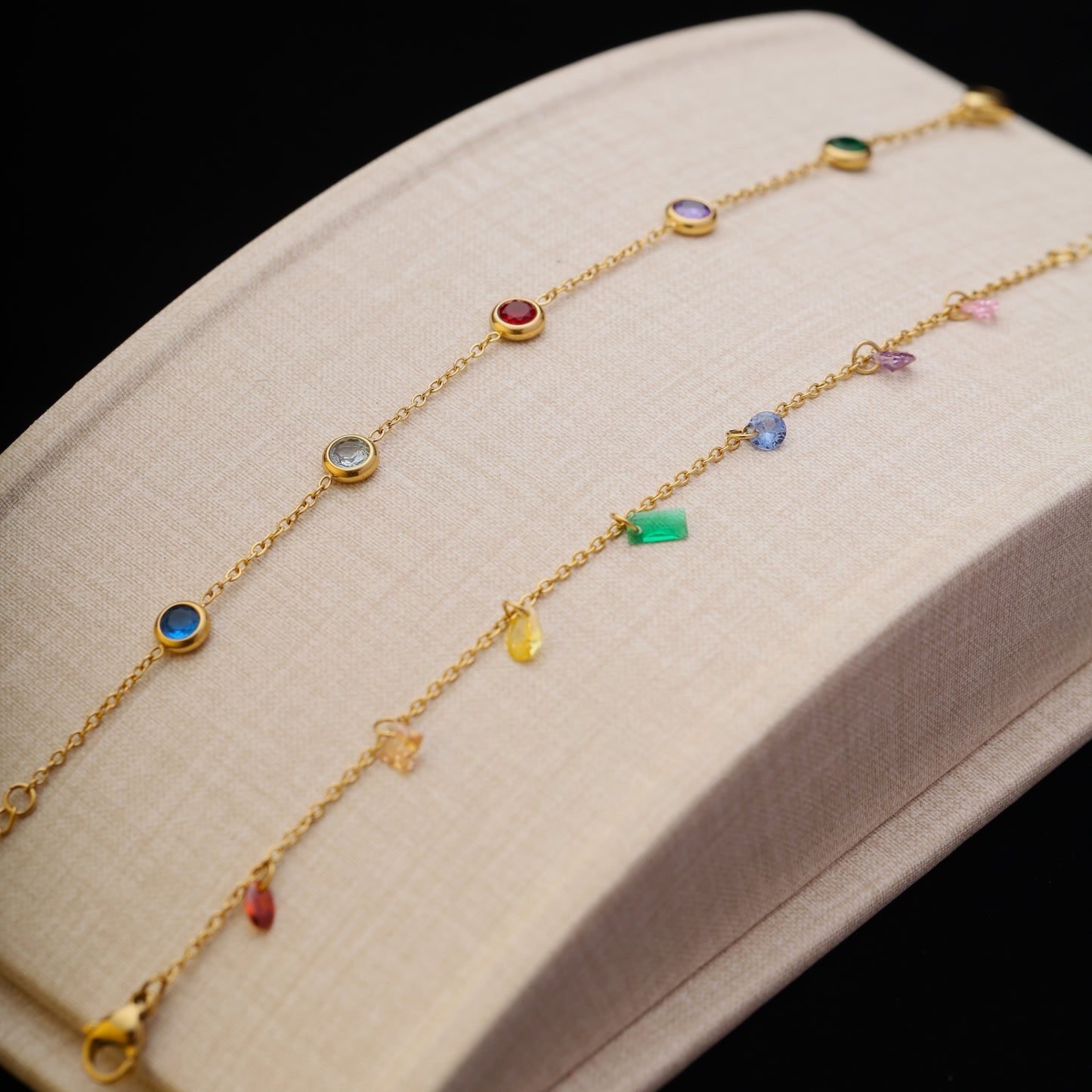 Layered rainbow bracelets displayed side by side