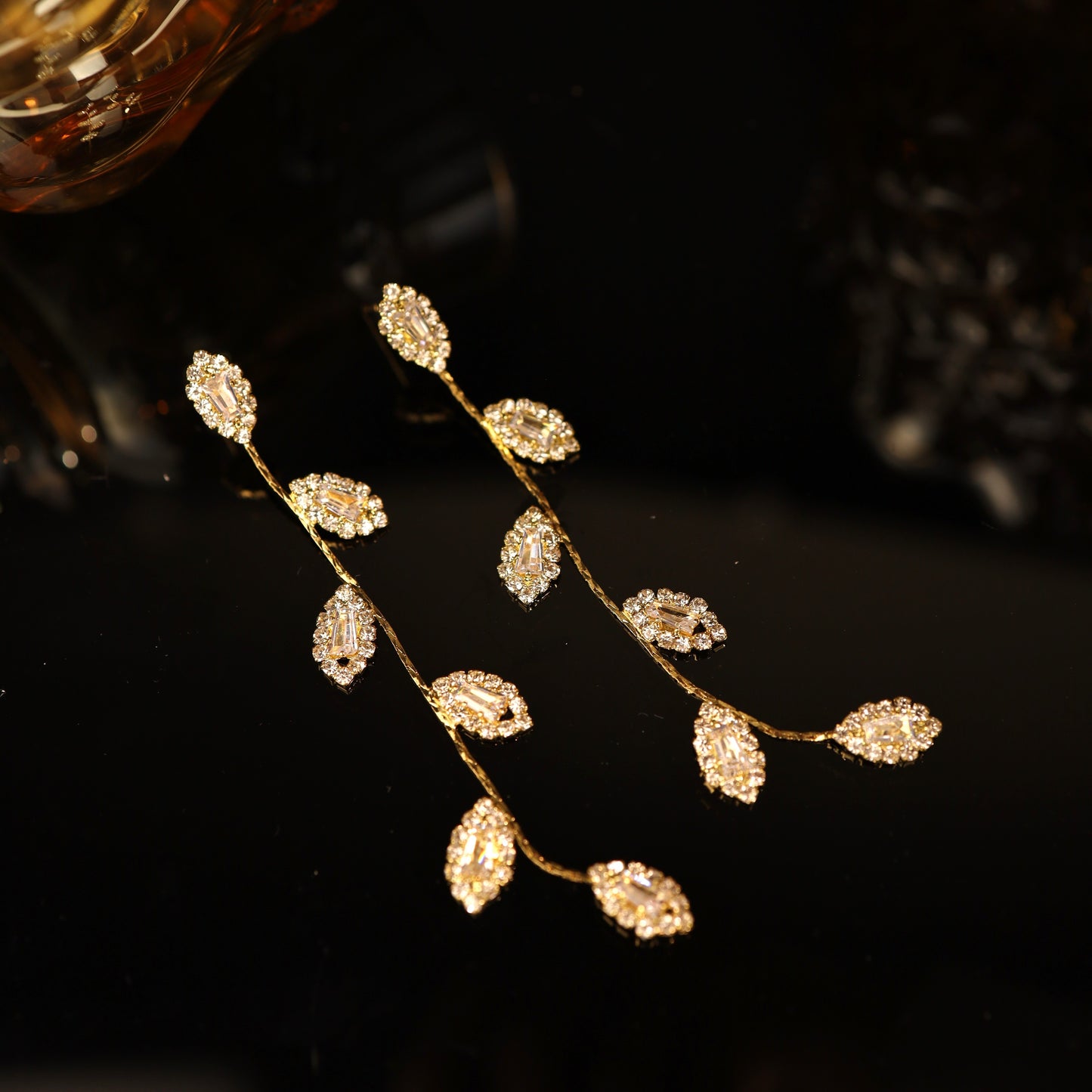 Delicate and lightweight leaf-inspired dangle earrings, designed for effortless elegance.