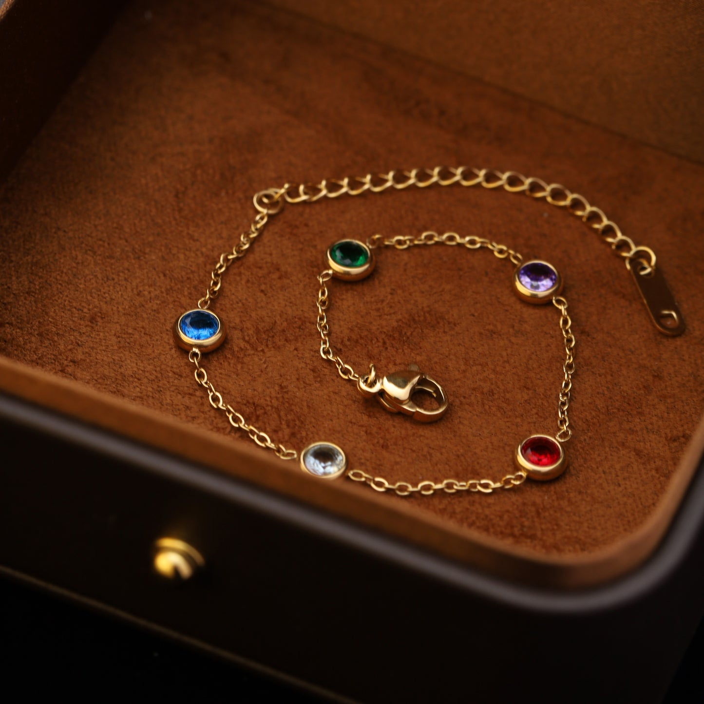 Rainbow gemstone bracelet flatlay on beige box