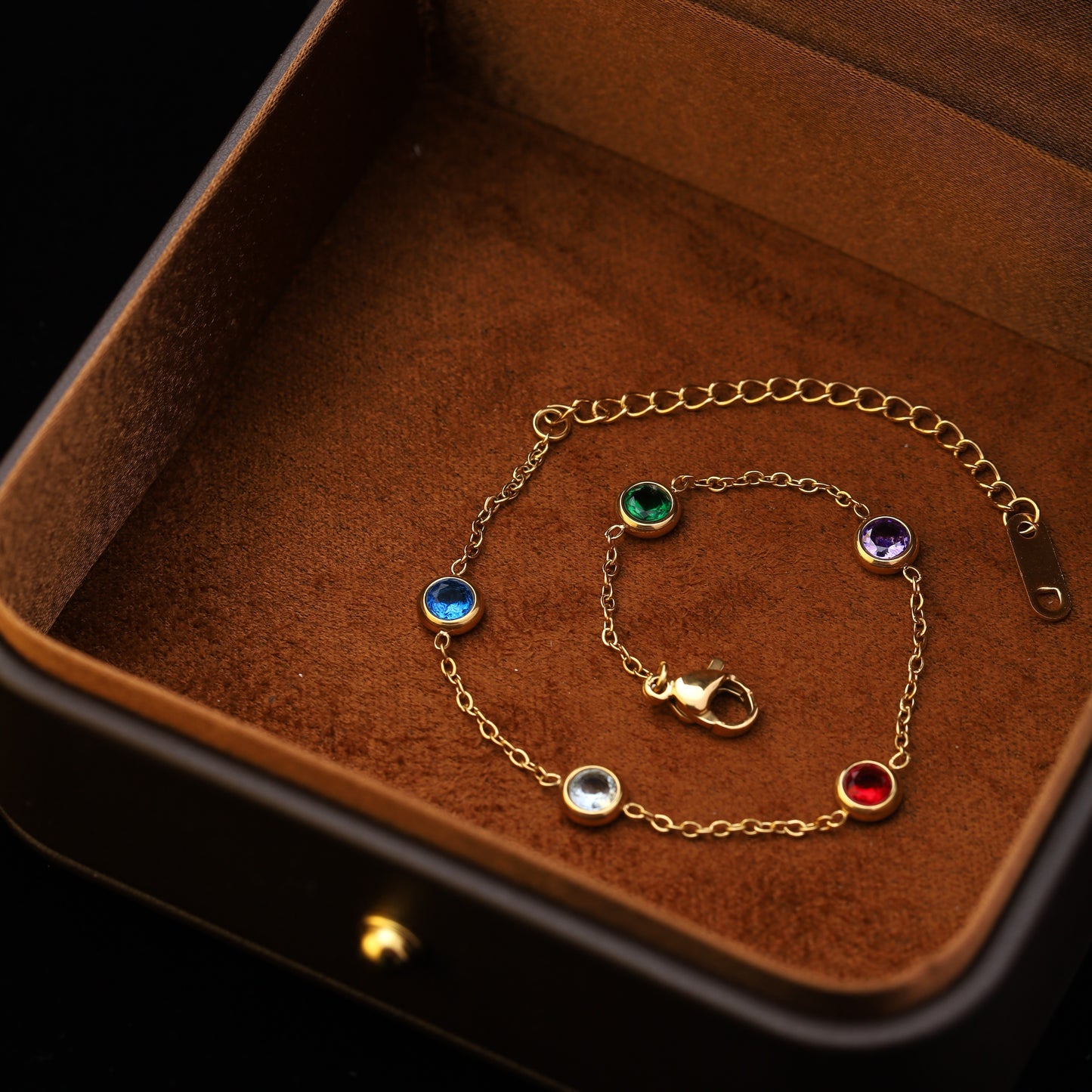 Delicate gold bracelet with rainbow crystals in box