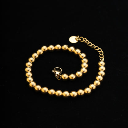 lat lay on black background showing entire 15cm + 5cm bracelet with lobster clasp