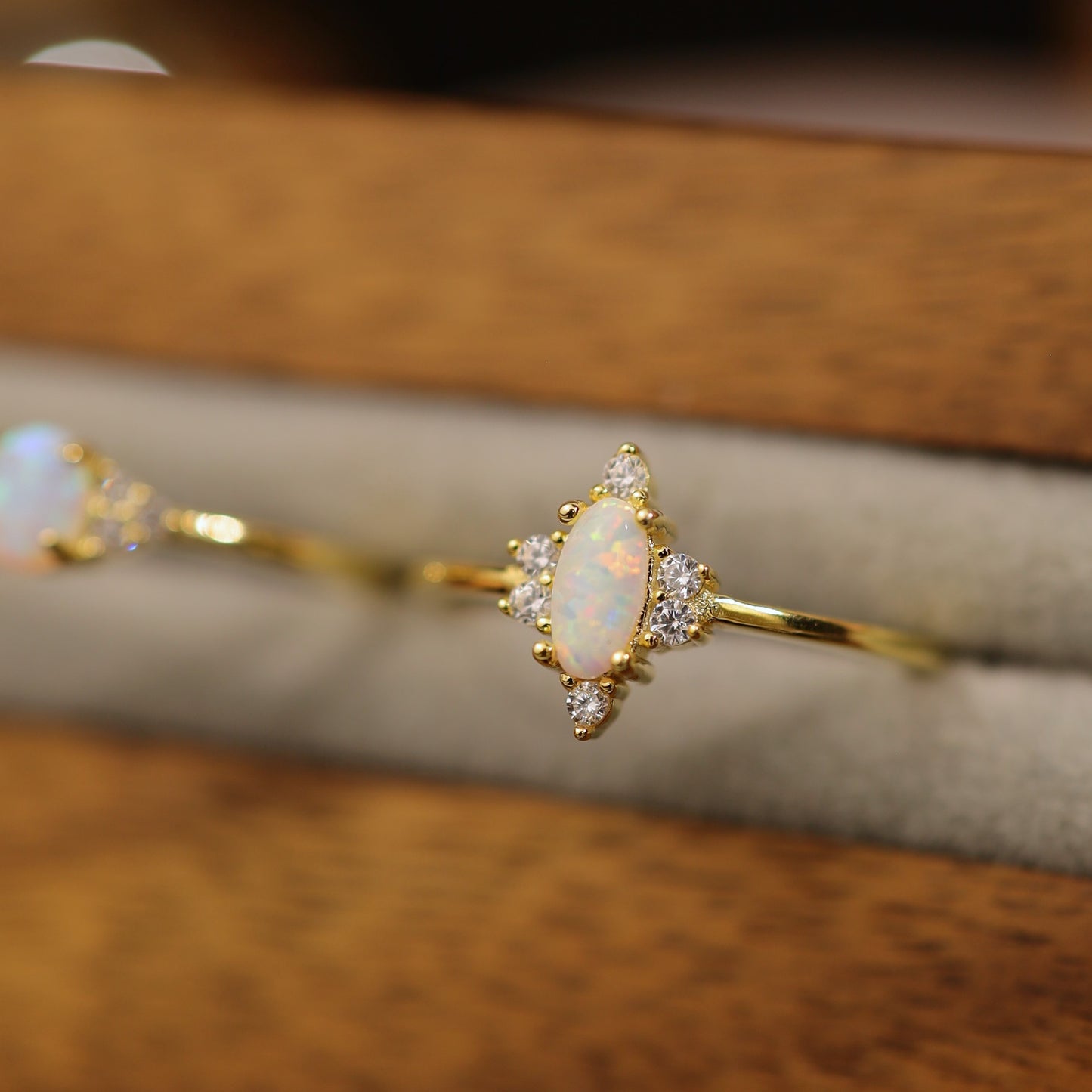 Dainty gold opal ring with marquise fire opal and cubic zirconia accents
